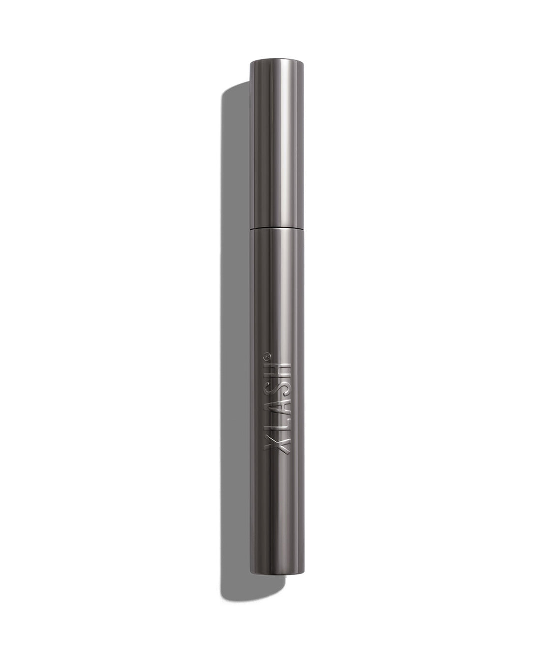 Xlash Drama Tinted Primer -ripsivärinpohjustaja tyylikkäässä tumman harmaassa hylsyssä.